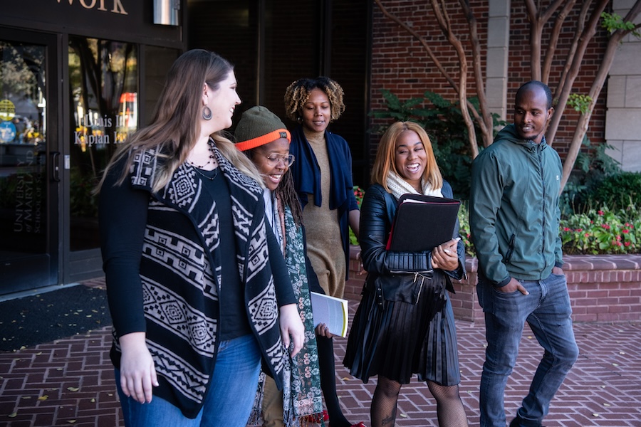 students walking out of building