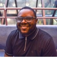 Headshot of Tay Johnson, DSW Program Coordinator