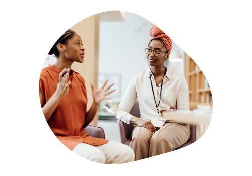 women sitting and talking