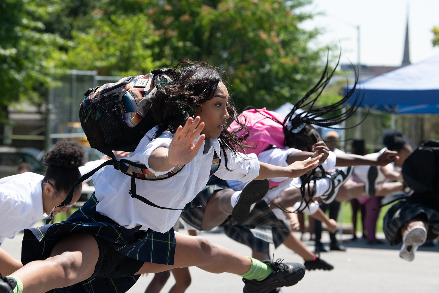 Girl student jumping in air