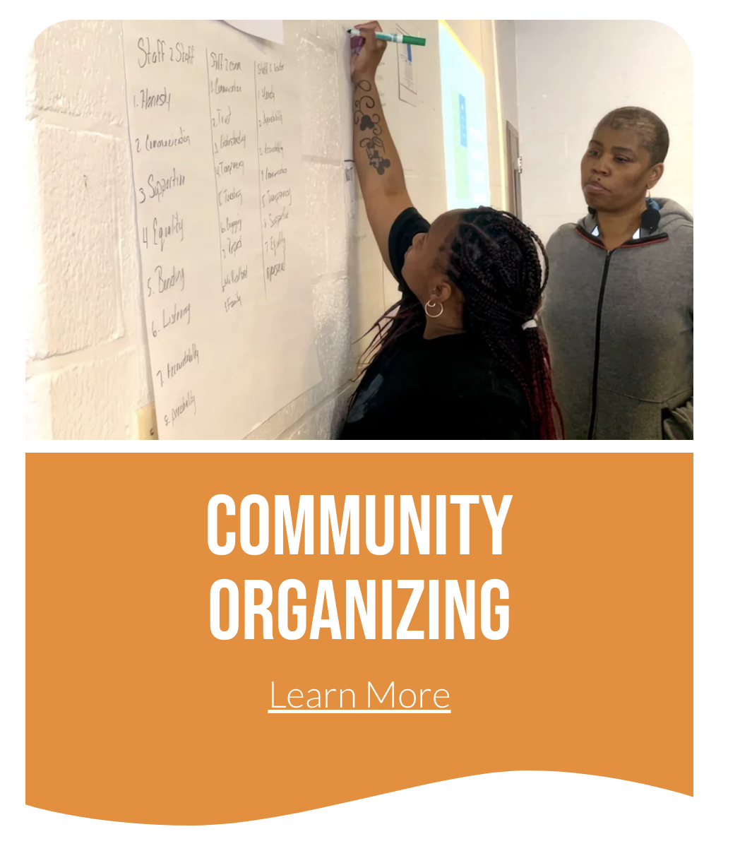 Woman righting on board, community organizing learn more